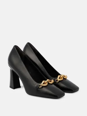 Black leather high heel pumps